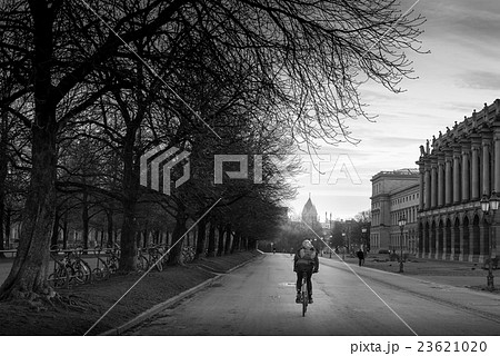 student cycling on the road in evening student cycling on the road in evening 23621020