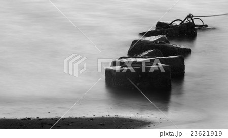 Concrete block in sea with long exposure technique 23621919