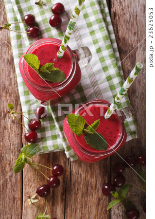 Homemade cherry smoothie with mint in glass jar  23625053