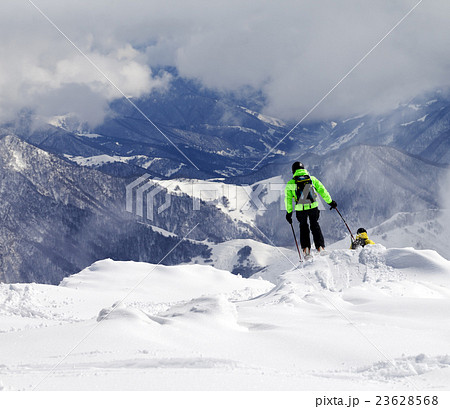 Freeriders on off-piste slope in mist Freeriders on off-piste slope in mist 23628568