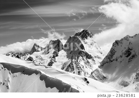 Black and white winter mountains with snow cornice 23628581