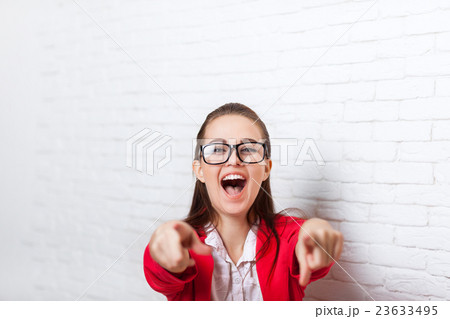 Businesswoman happy excited laughing point finger Businesswoman happy excited laughing point finger 23633495