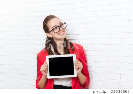 Businesswoman show tablet computer screen with Businesswoman show tablet computer screen with 23633665