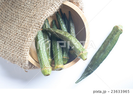 Healthy okra chips on clean background Healthy okra chips on clean background 23633965