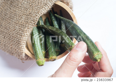 Healthy okra chips on clean background 23633967