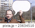 a man with a sign 23634510