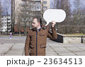 a man with a sign 23634513