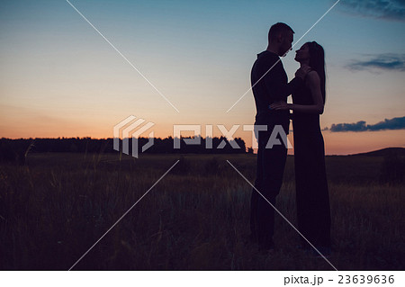 Love story . Couple at sunset. On the background Love story . Couple at sunset. On the background 23639636