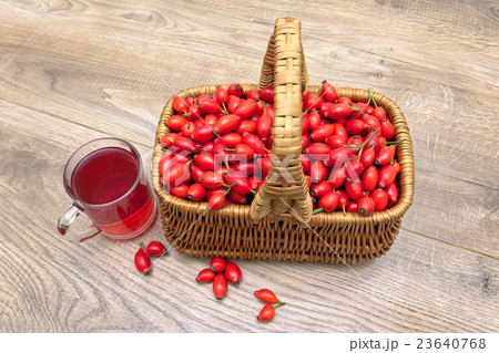ripe rosehip berries in a basket on a wooden ripe rosehip berries in a basket on a wooden 23640768