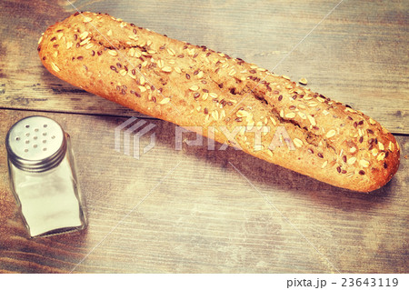 Vintage toned fresh wholewheat baguette. Vintage toned fresh wholewheat baguette. 23643119