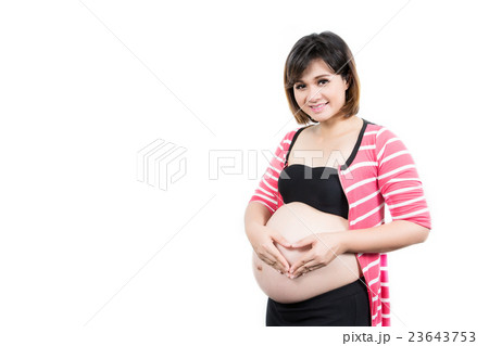 Portrait of the beautiful 9 month pregnant woman with heart from 23643753