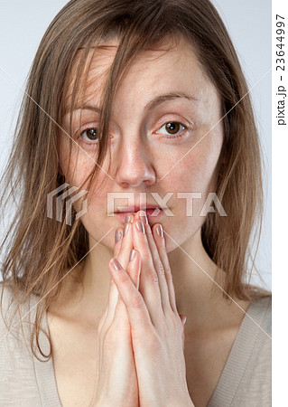 sad woman, hands are folded in prayer sad woman, hands are folded in prayer 23644997