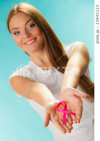 pink breast cancer awareness ribbon on womans hands pink breast cancer awareness ribbon on womans hands 23645123