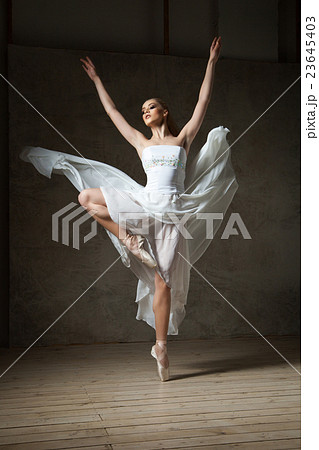 Beautiful ballerina dancing in white dress 23645403