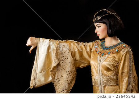 Serious Egyptian woman like Cleopatra with thumbs Serious Egyptian woman like Cleopatra with thumbs 23645542