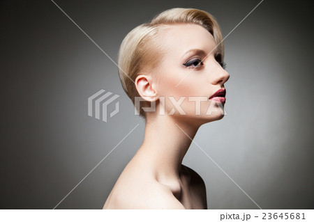studio shot of young blonde model with hairstyle studio shot of young blonde model with hairstyle 23645681