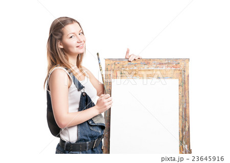 Young smiling woman painter with paintbrush 23645916