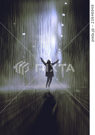 silhouette of man raising arms in the rain at nigh 23646949