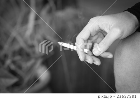 Close up hand holding cigarette. stop smoking 23657581
