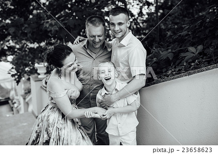 Portrait of Happy Family In Park - outdoor shot Portrait of Happy Family In Park - outdoor shot 23658623