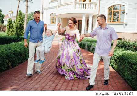 Portrait of Happy Family In Park - outdoor shot Portrait of Happy Family In Park - outdoor shot 23658634