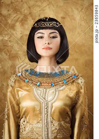 Beautiful Egyptian woman like Cleopatra on golden 23659843