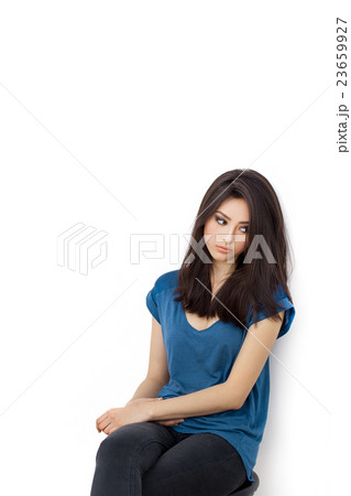 Young bored upset woman sitting on chair 23659927