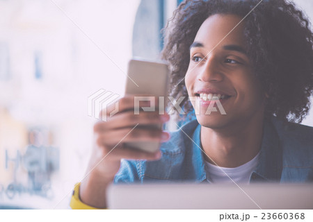 Young confident man answering call 23660368