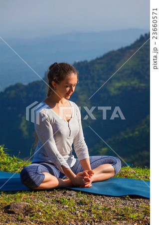 Sporty fit woman practices yoga asana Baddha 23660571