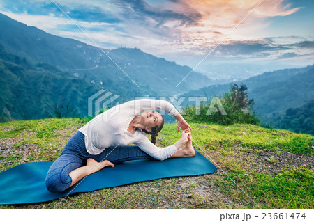 Young sporty fit woman doing Hatha Yoga asana in 23661474