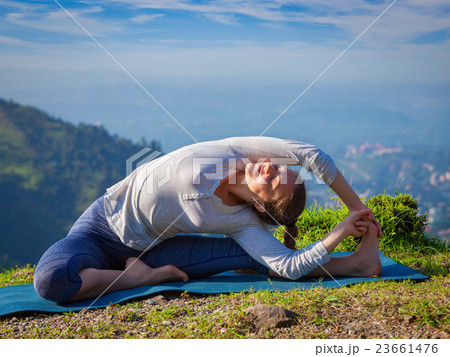 Young sporty fit woman doing Hatha Yoga asana 23661476