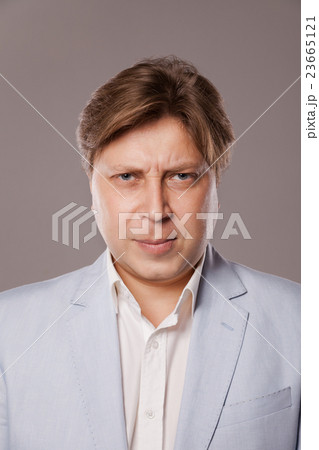 Angry Frowning Middle Age Man in Blue Jacket 23665121