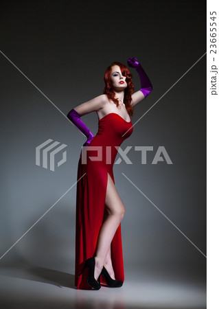 Woman dressed in red elegant dress 23665545