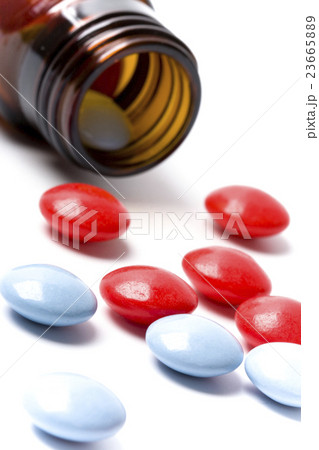 bottle with red and blue pills 23665889