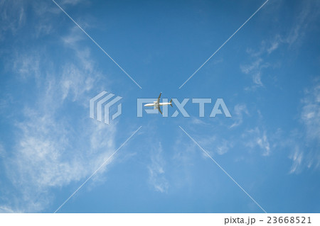 A plane flying blue sky with clouds A plane flying blue sky with clouds 23668521