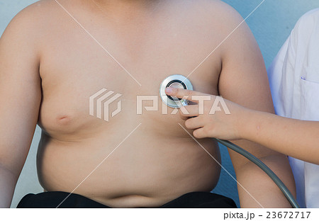 Obese asian boy check heart by stethoscope 23672717