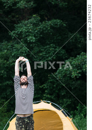 Man stretching in forest, freedom from urban 23674232