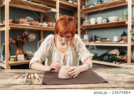 Workshop of craftsman pottery, pot decorating 23674964
