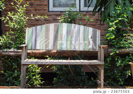 lacquered wooden garden bench on the lawn lacquered wooden garden bench on the lawn 23675503