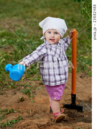 funny boy with shovel in garden funny boy with shovel in garden 23682488
