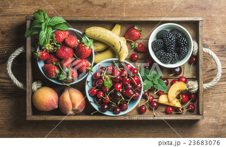 Summer fresh fruit and berry variety in rustic Summer fresh fruit and berry variety in rustic 23683076