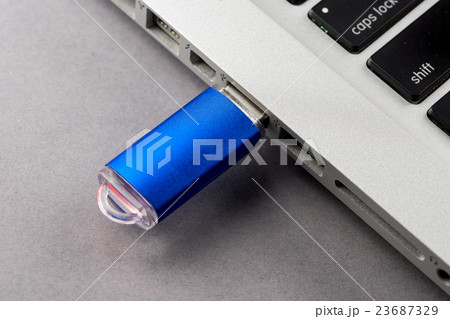 USB Flash drive on computer laptop keyboard USB Flash drive on computer laptop keyboard 23687329
