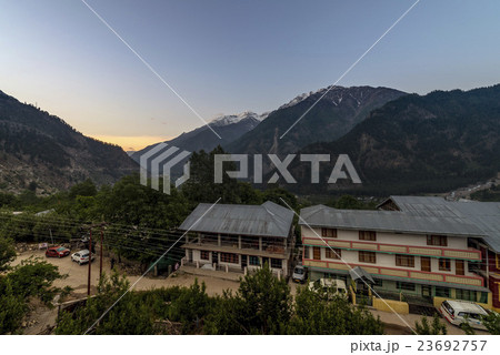 A small town village at top of hill.  23692757