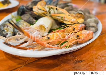 Seafood on white dish, 23696060