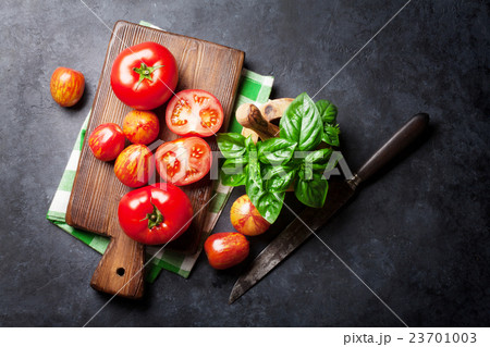 Fresh ripe garden tomatoes and basil Fresh ripe garden tomatoes and basil 23701003