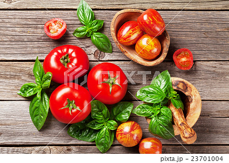 Fresh ripe garden tomatoes and basil 23701004