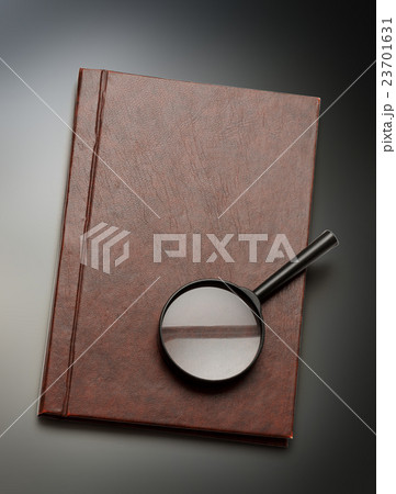 Notepad and magnifying glass Notepad and magnifying glass 23701631