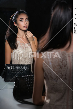 Reflection of nice young brunette 23703722