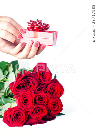 bouquet of roses and hand with gift 23717988