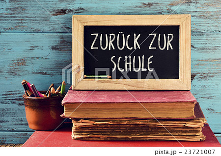 text back to school in German in a chalkboard 23721007